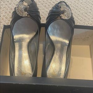 Chic Black Heels with Crystal Detail
Designer never worn.